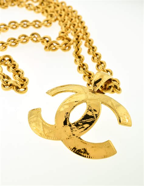 chanel gold logo necklace|Chanel pendant logos 10k.